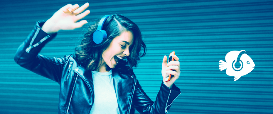 A woman wearing a black leather jacket and a white shirt is dancing while listening to the music from her head phones