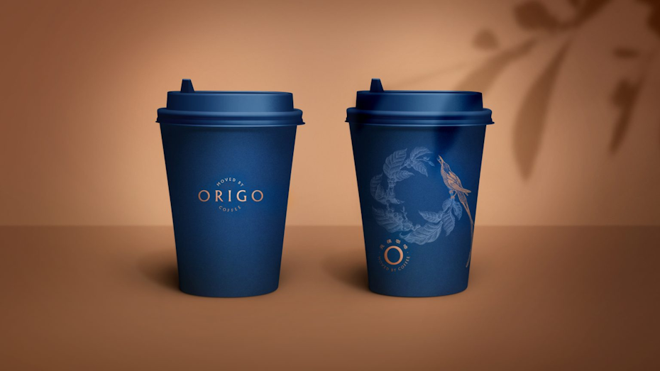 two blue coffee cups with a bird on a branch illustration