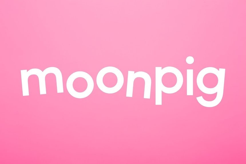 floating text of moonpig in white color against a pink background