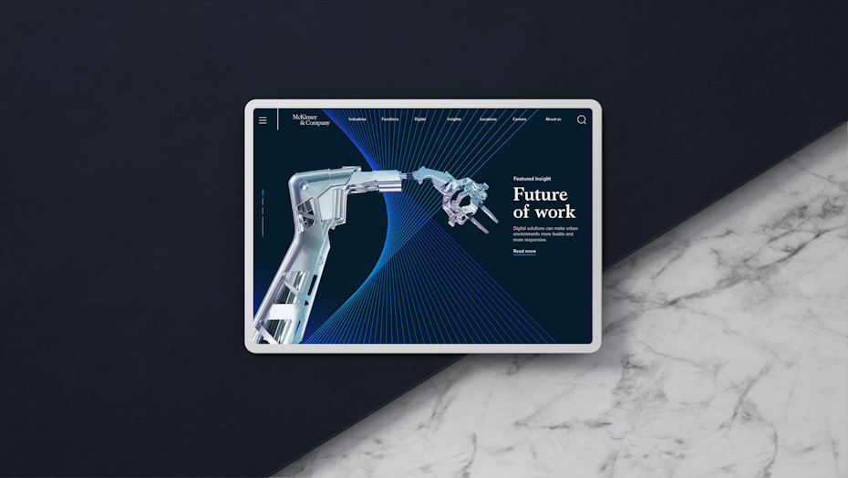 a tablet displays a white and silver robot against a blue background