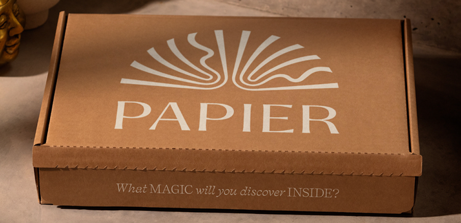 white text logo on cardboard box