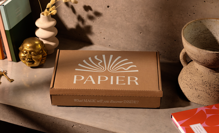 white text logo on cardboard box