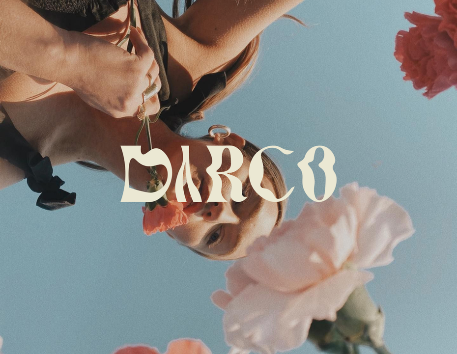 white text logo against colorful photo background