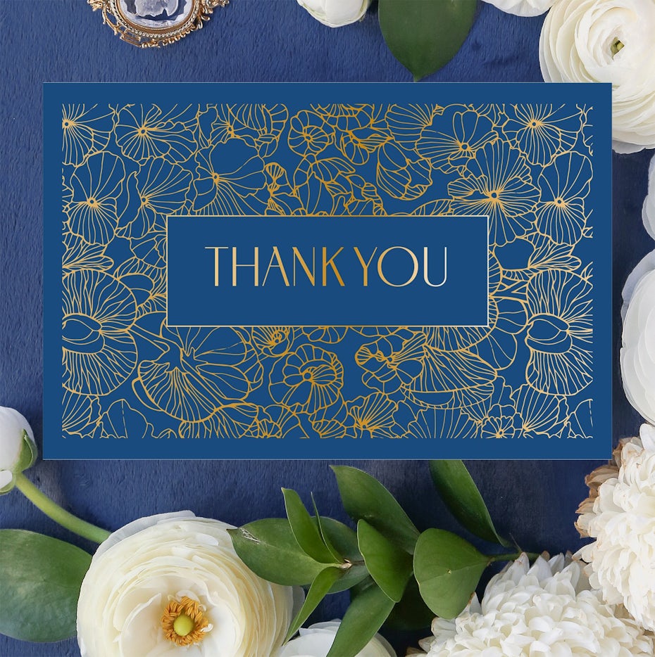 Dankeskarte mit Blumendesign in blau und gold
