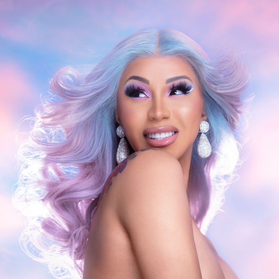 Cardi B with pastel hair against a pastel background