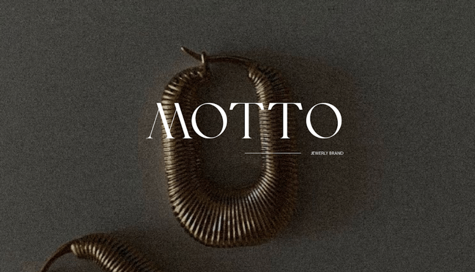 White vtext logo for Motto jewelry brand
