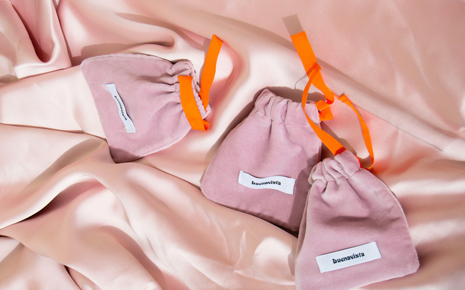 pink velvet pouches with orange drawstrings