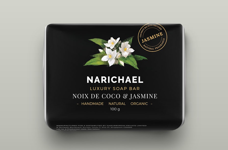 all-black packaging with a white flower on the front