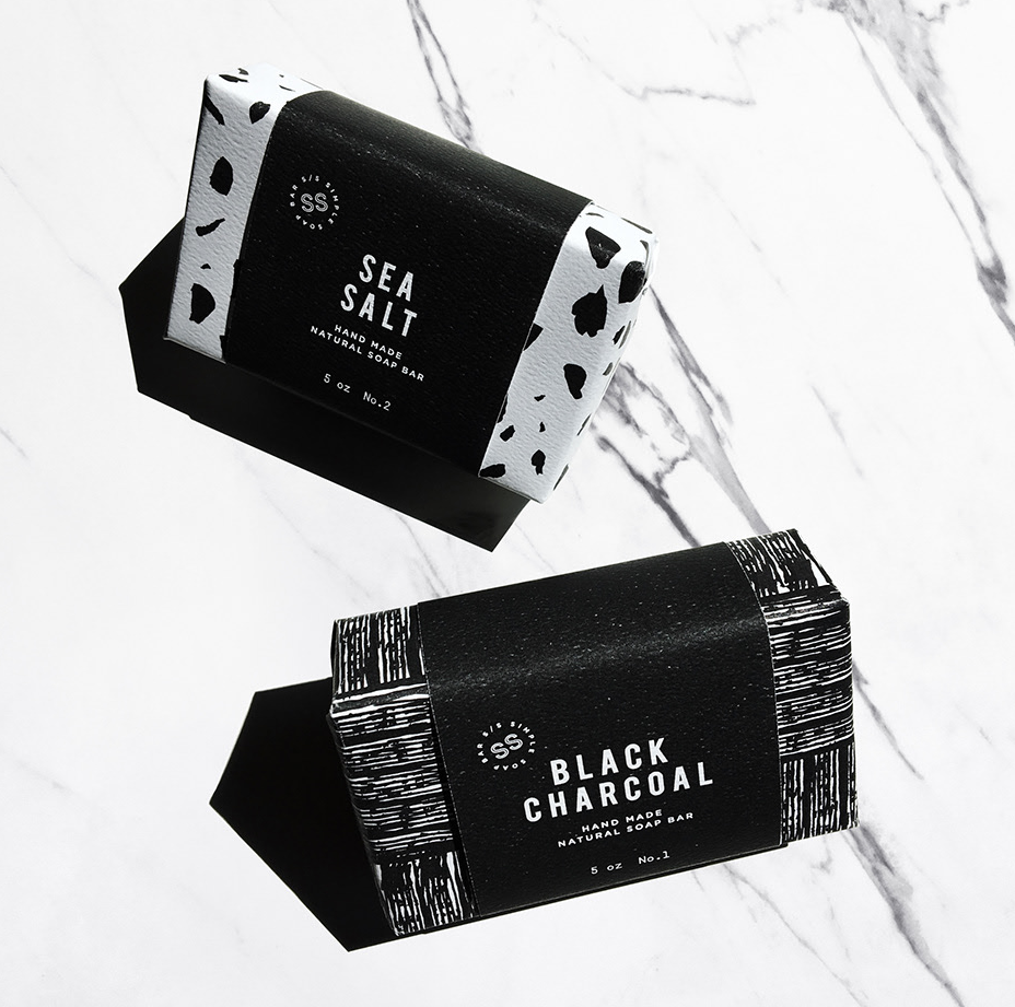 black and white soap packaging with a cross-hatched design