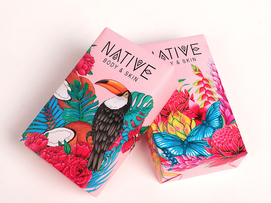 two pink soap packages, one with a toucan and flowers and the other with just flowers
