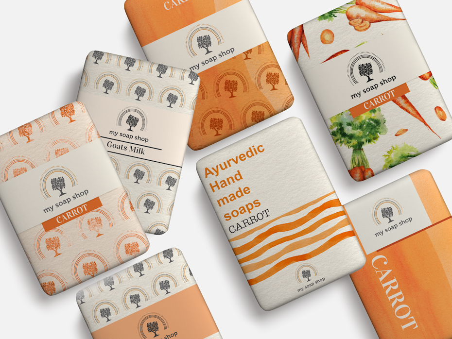 orange, gray and white packaging featuring carrots, trees and lines