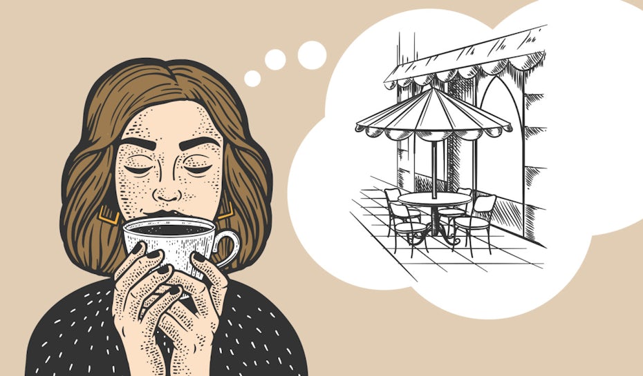 person drinking coffee imagining a cafe terrace