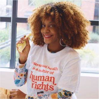 Woman wearing a t-shirt reading, ‘menstrual health is a matter of human rights’