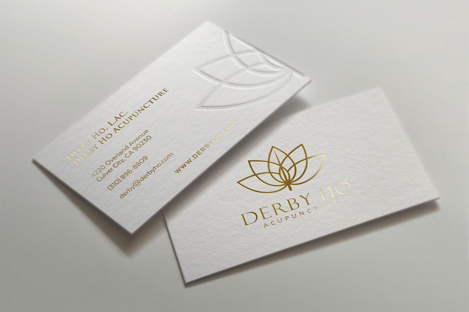 gold plant-inspired geometric logo on a white card