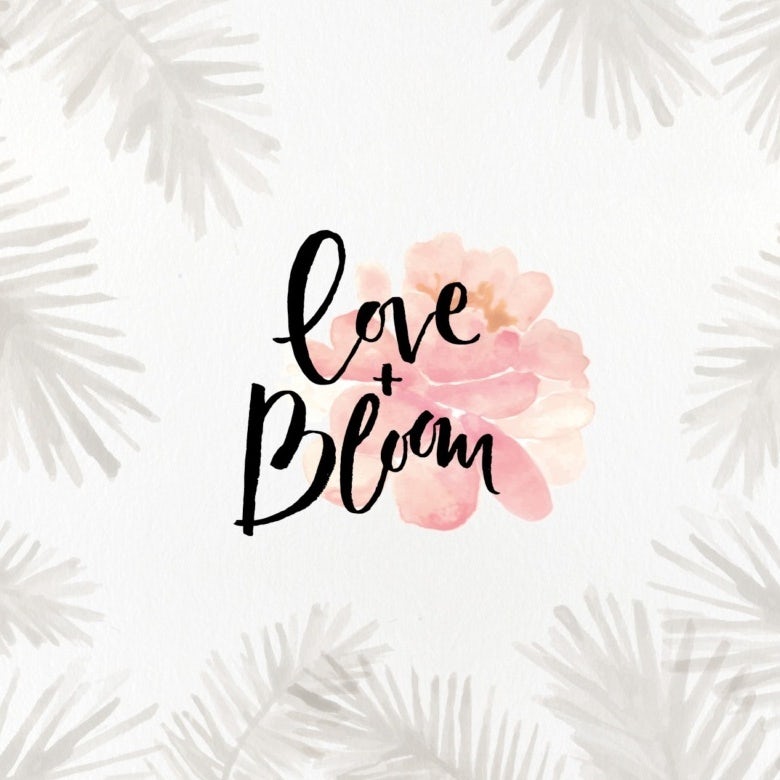 pink flower watercolor logo with black text across it