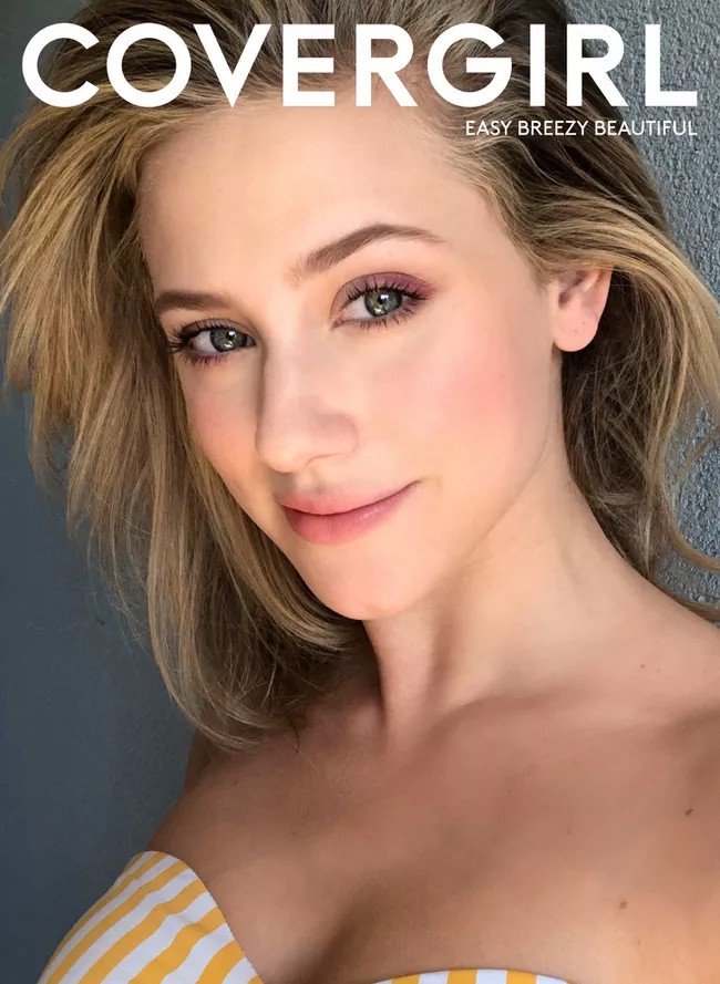 A woman smiles for a photo for cosmetic makeup’s ad campaign