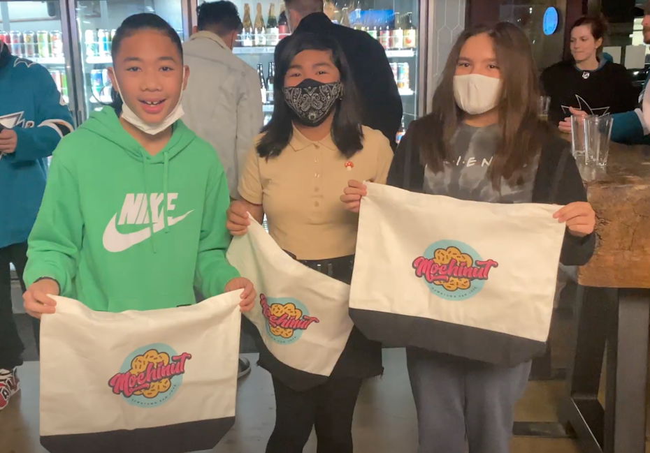 kids holding tote bags