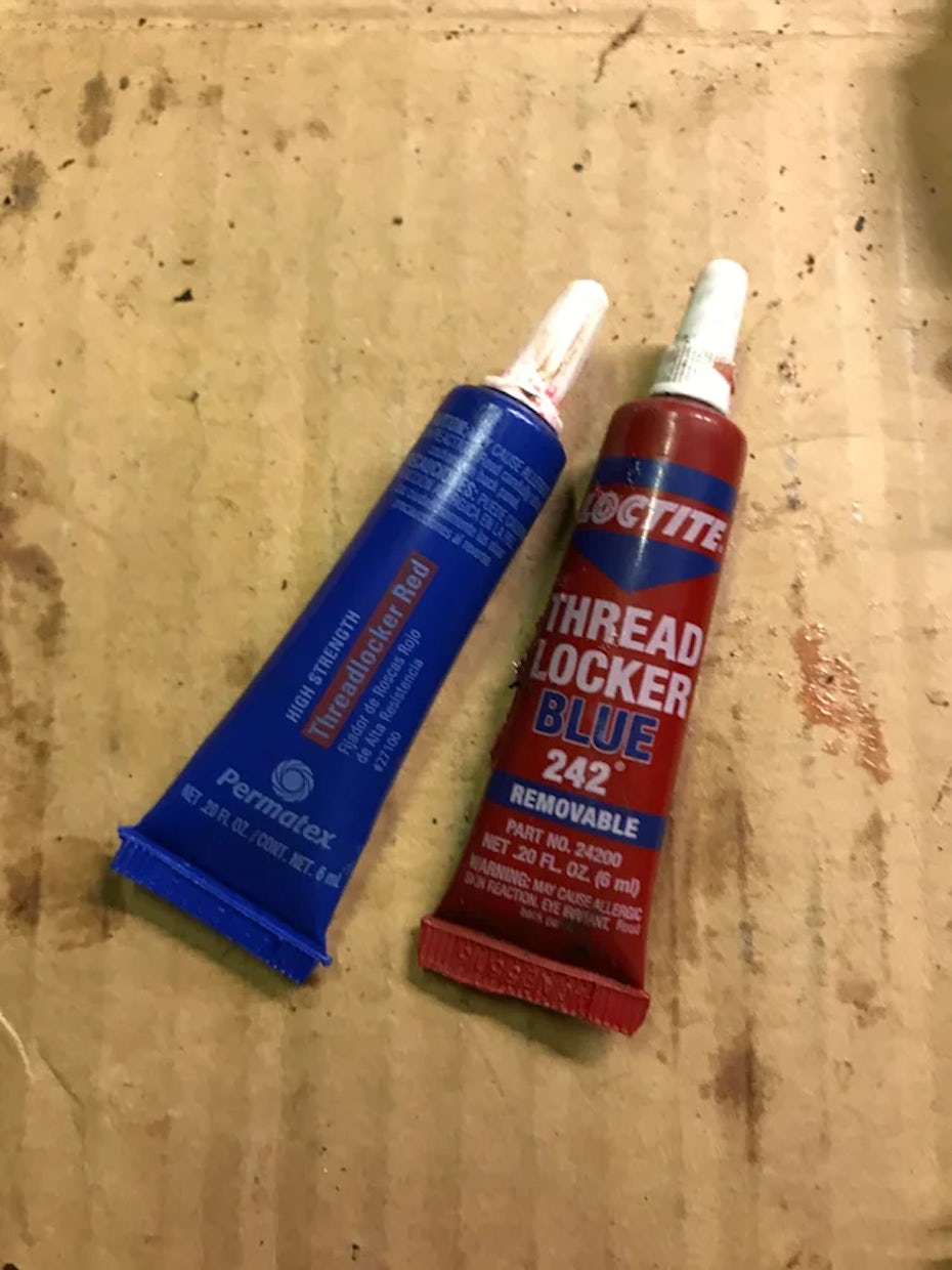 Photo of red and blue paint tubes with mismatched color packaging