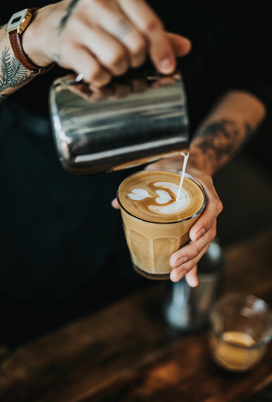 a barista creating latte art