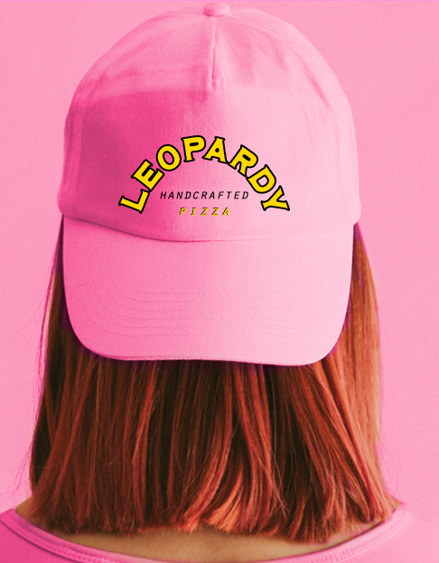 a person wearing a bright pink hat with leopardy's logo
