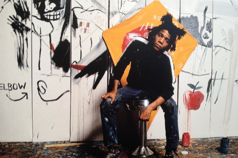 Photograph of Jean-Michel Basquiat in his studio