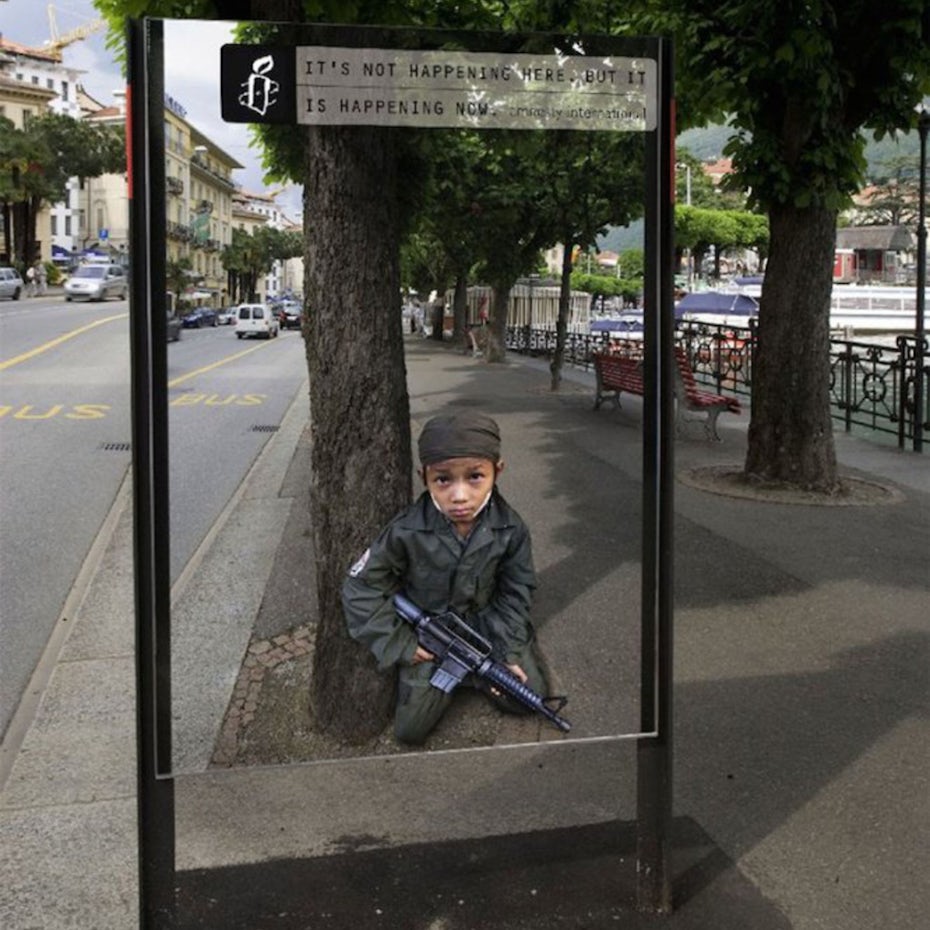 amnesty international bus station ad